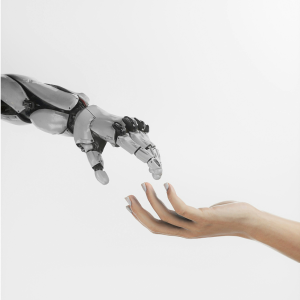 a human hand holding a robot hand